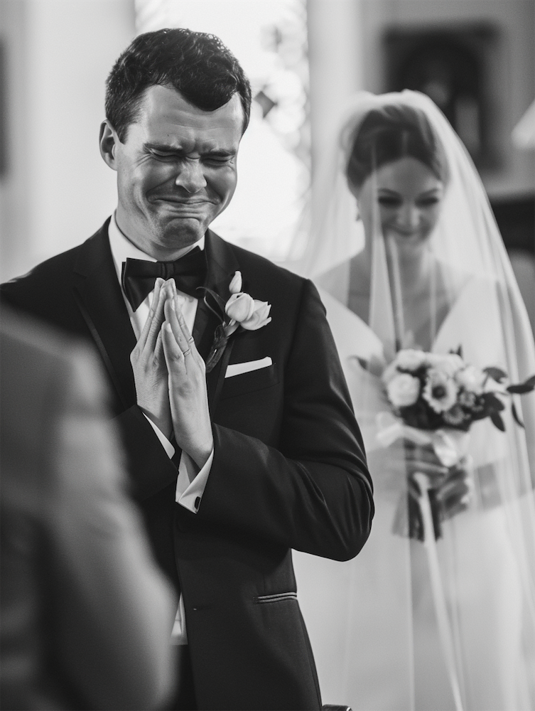 Groom crying in wedding